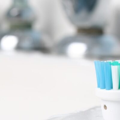 Toothbrush on white sink - is fluoride in your water?