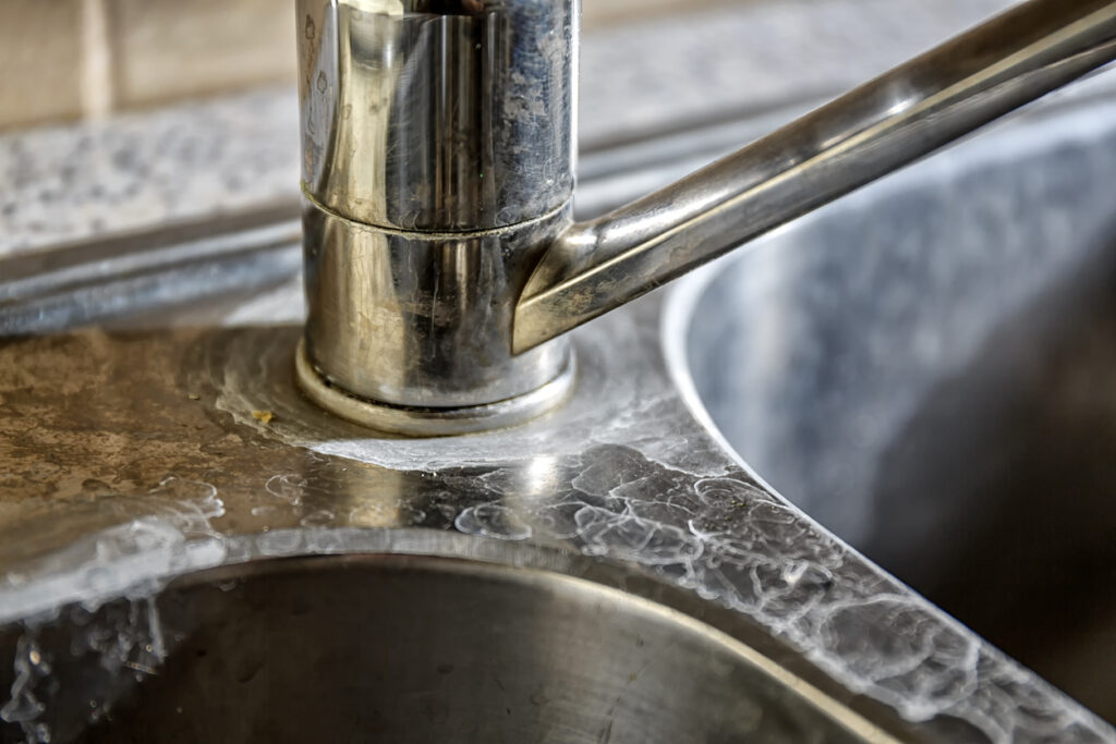 hard water stains on a kitchen faucet in St. Petersburg