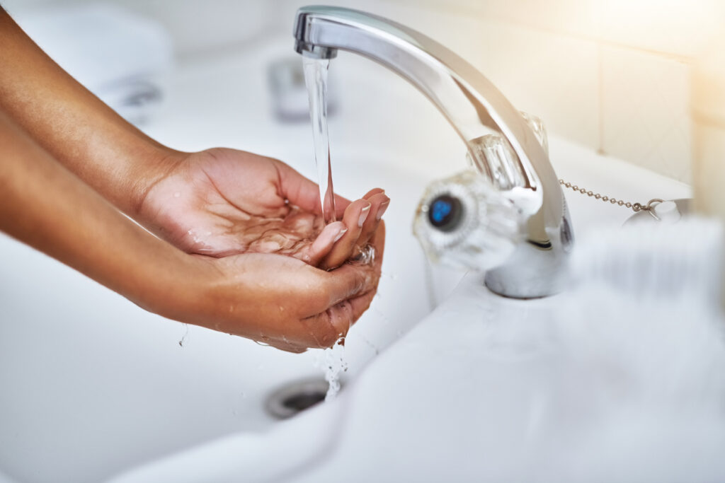 lady washing her hands with soft water
