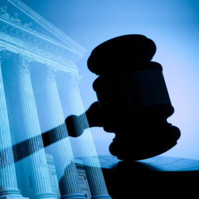A gavel and the United States Supreme Court building.