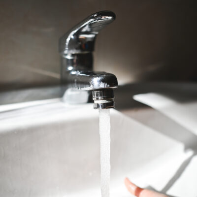 Close up of running water at home from a faucet